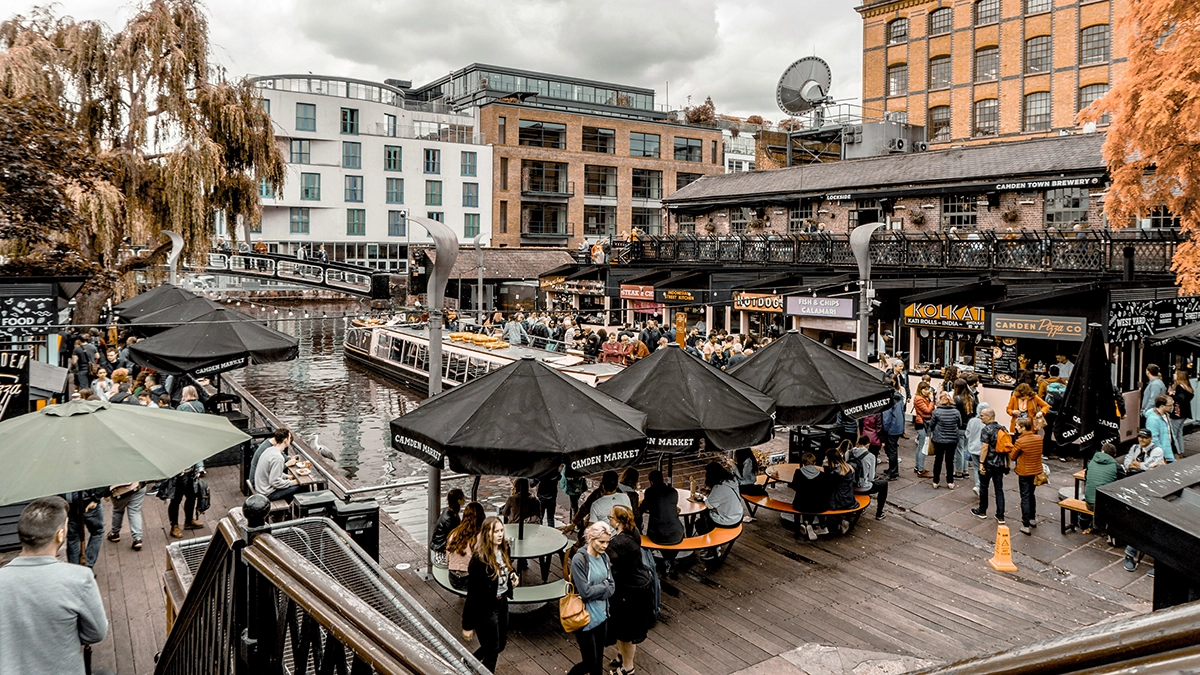 A crowd of shoppers take a break at Camden Market's many food stalls