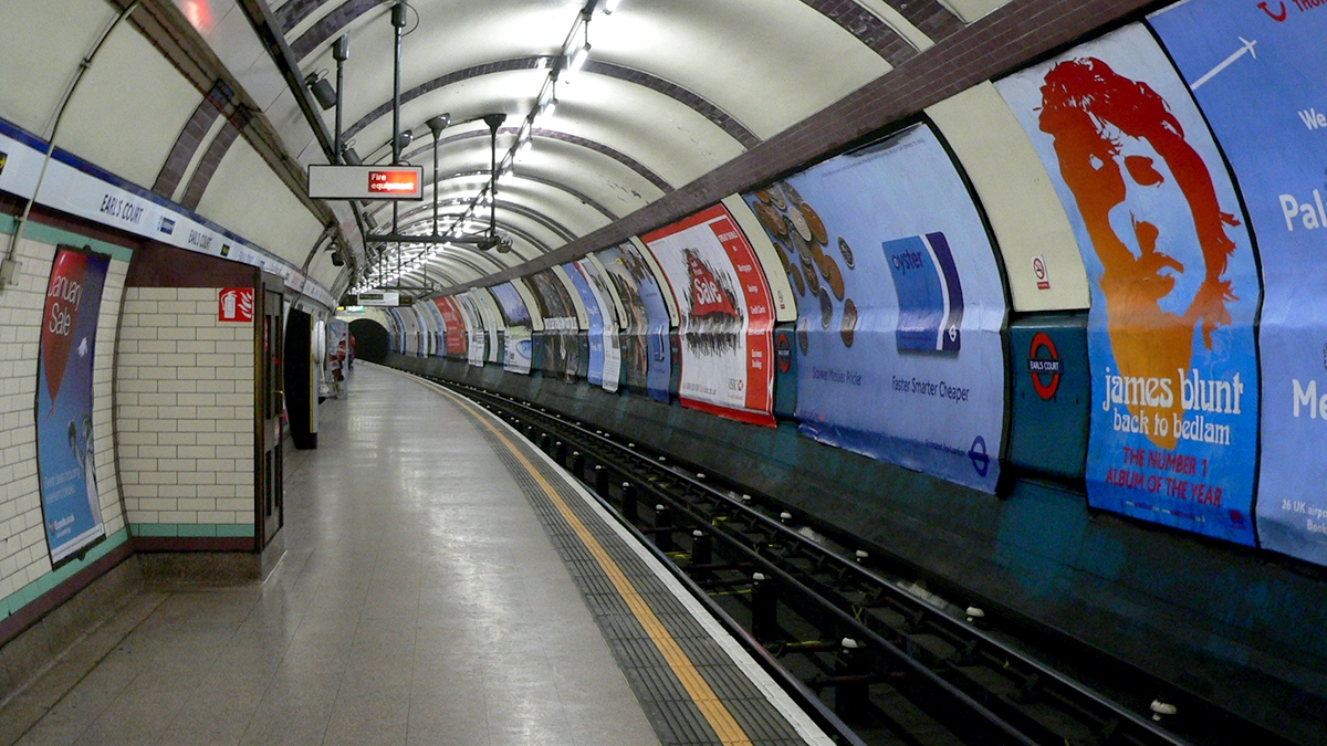 Cross track adverts at Earl's Court underground station at platform level