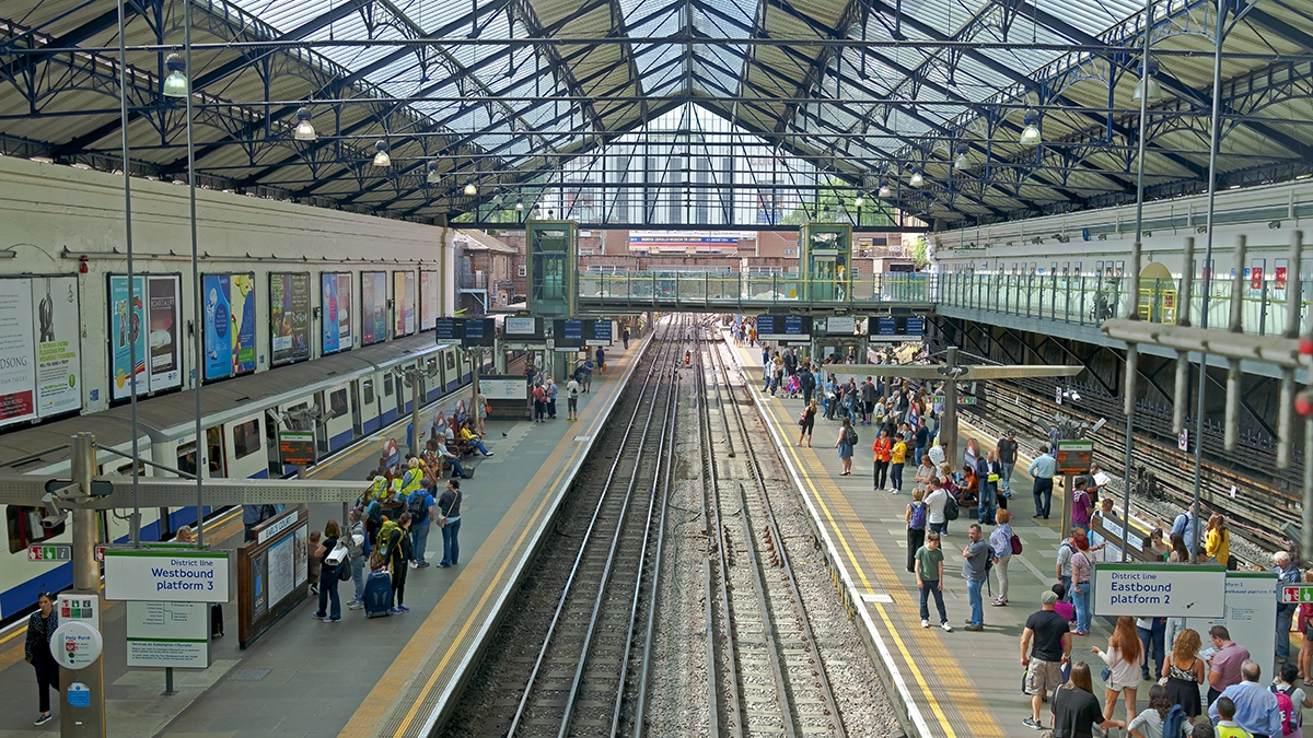 Cross track posters at the surface level platforms at Earl's Court station