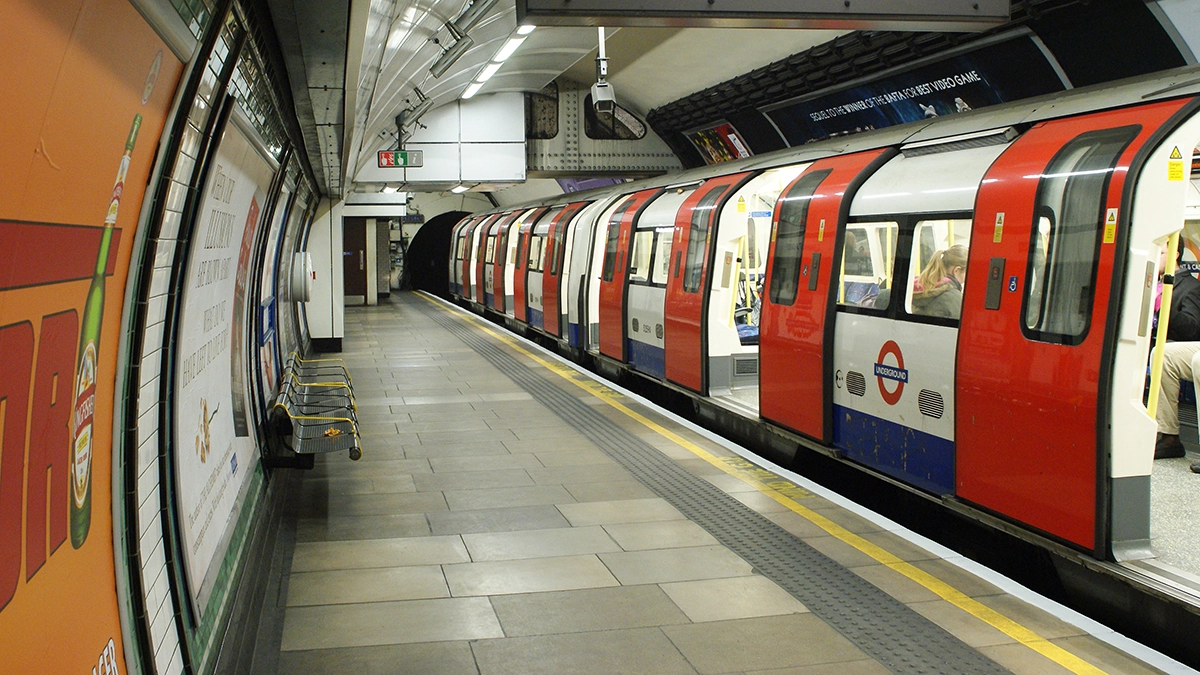 Platform level adverts next to a train in the platform at Elephant and Castle underground station