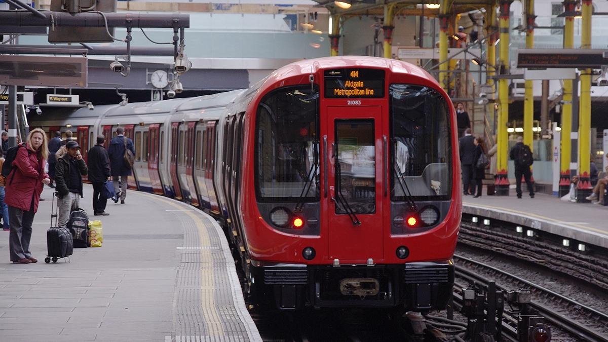 A tube train arriving at Farringdon underground station