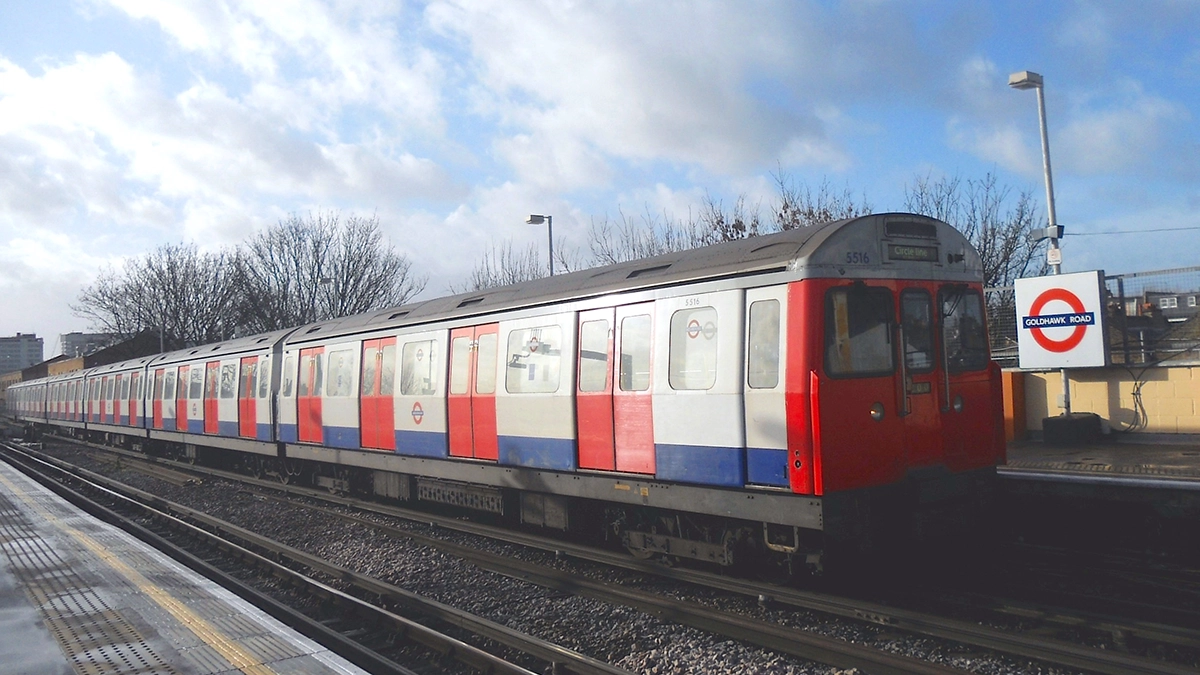 A tube train arriving at Goldhawk Road underground station