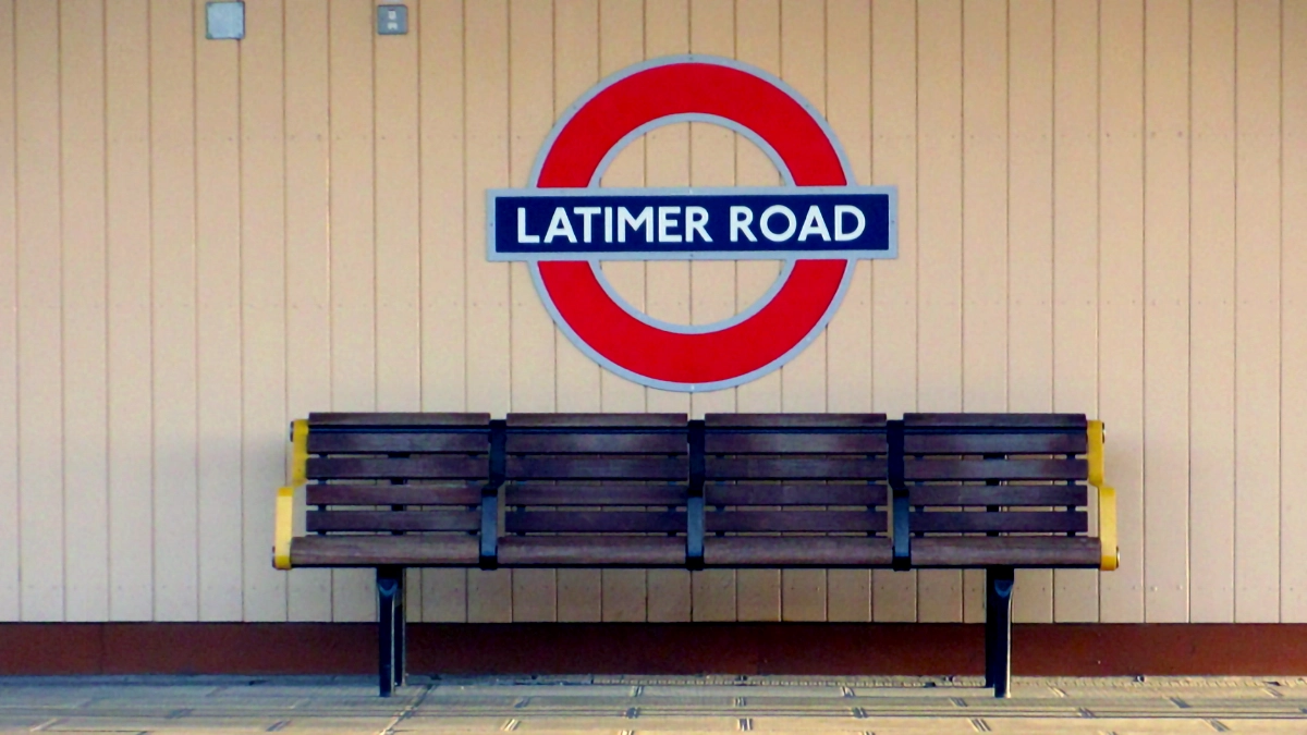Platform level roundel and bench at Latimer Road station