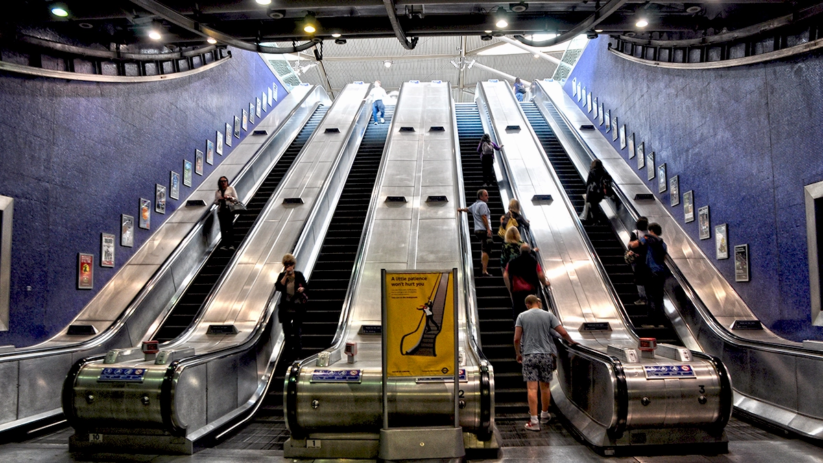 Escalator panel adverts next to the entrance at North Greenwich tube station