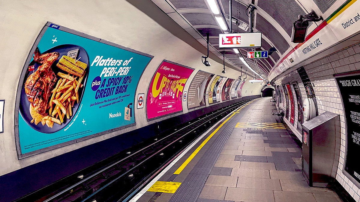 Cross track 48 sheet and platform level 16 sheet adverts at Notting Hill Gate underground station