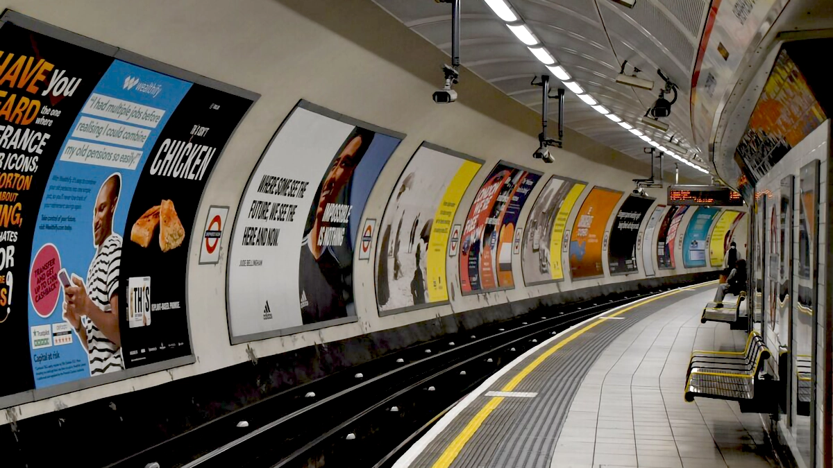 Cross track adverts dominate the platform at Shepherd's Bush tube station