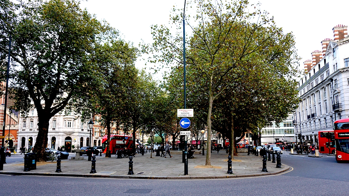 Sloane Square opposite the station with red London busses passing by