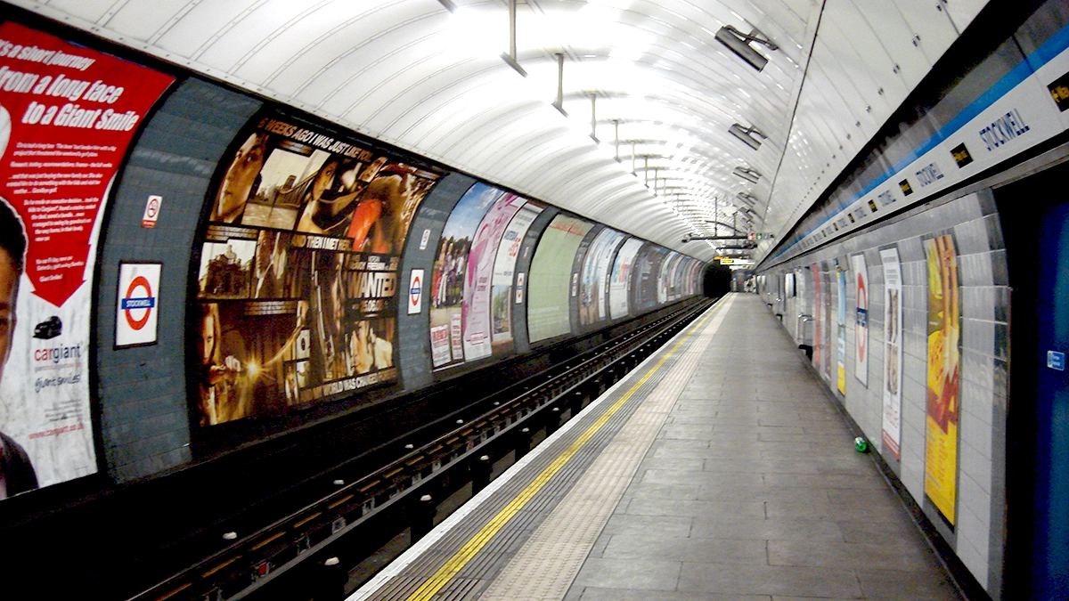 Platform adverts adorn the walls at Stockwell underground station