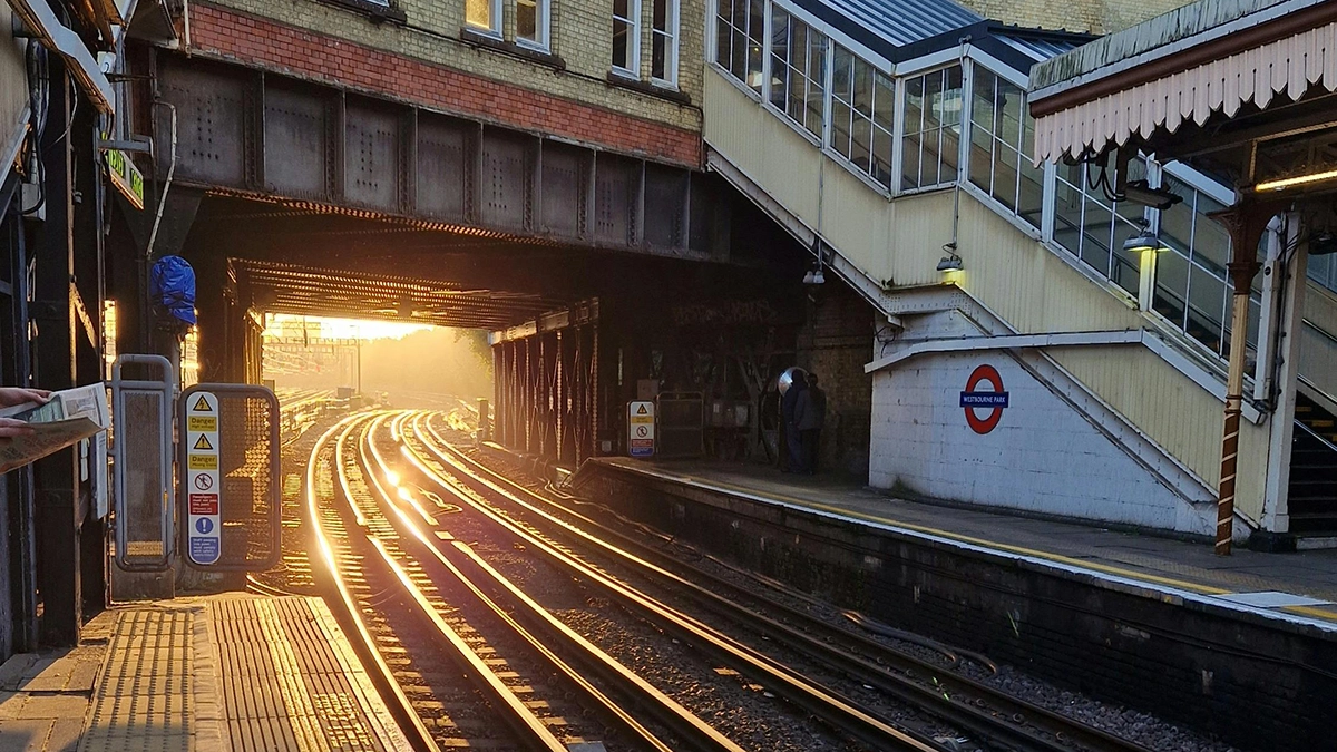 A view down the tracks from the surface level platforms at Westbourne Park station