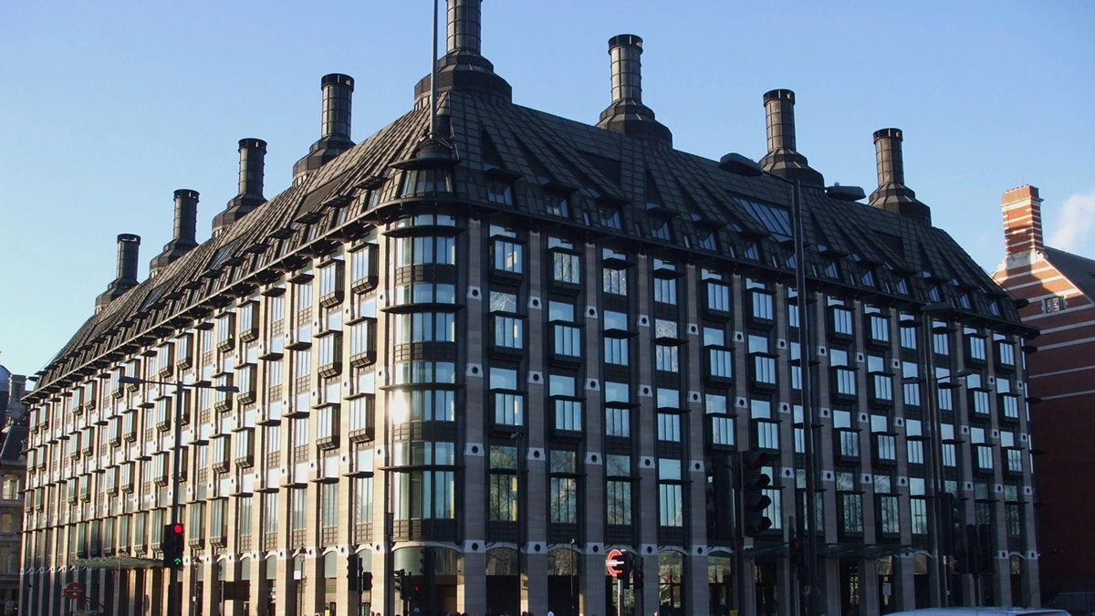 The exterior of Portcullis House with an Underground roundel showing the entrance to Westminster tube station